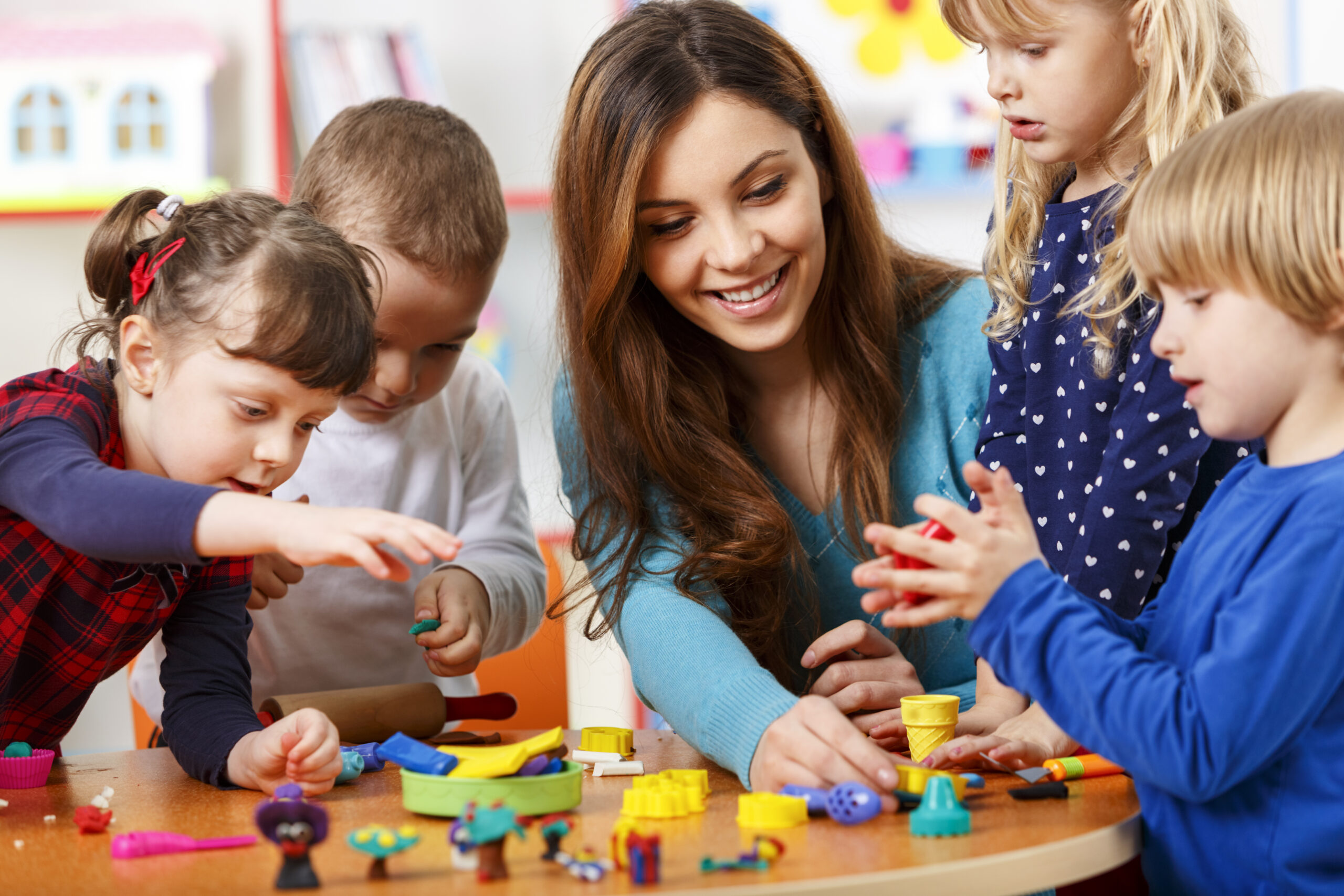 Behavioral Analyst and Children Playing with Blocks